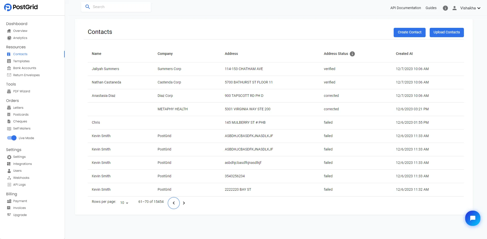 Contacts page in the PostGrid dashboard showing the Create Contact button in the top-right corner